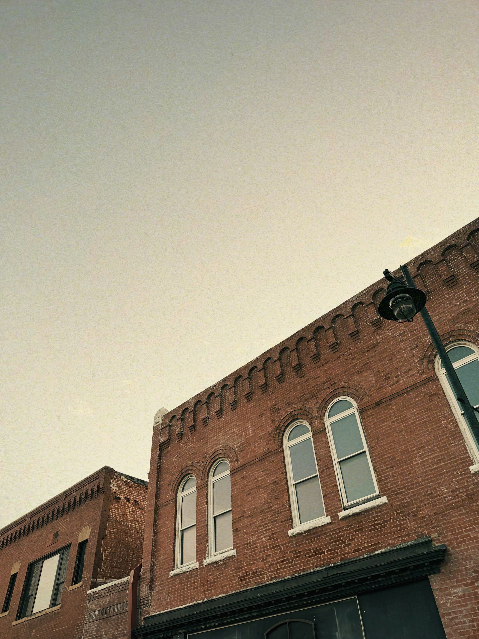 Historic red-brick storefronts on a small-town main street in Eastern North Carolina